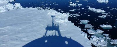 Shadow of research ship in icy waters, courtesy of Ian Brown