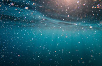 Underwater image showing specs of light