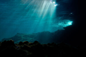 Under water image of the ocean with rays of light