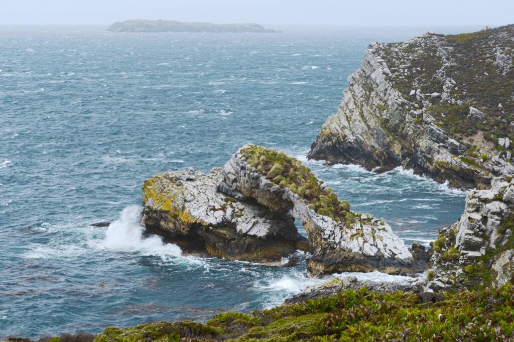 Sea crashing around coastline rocks