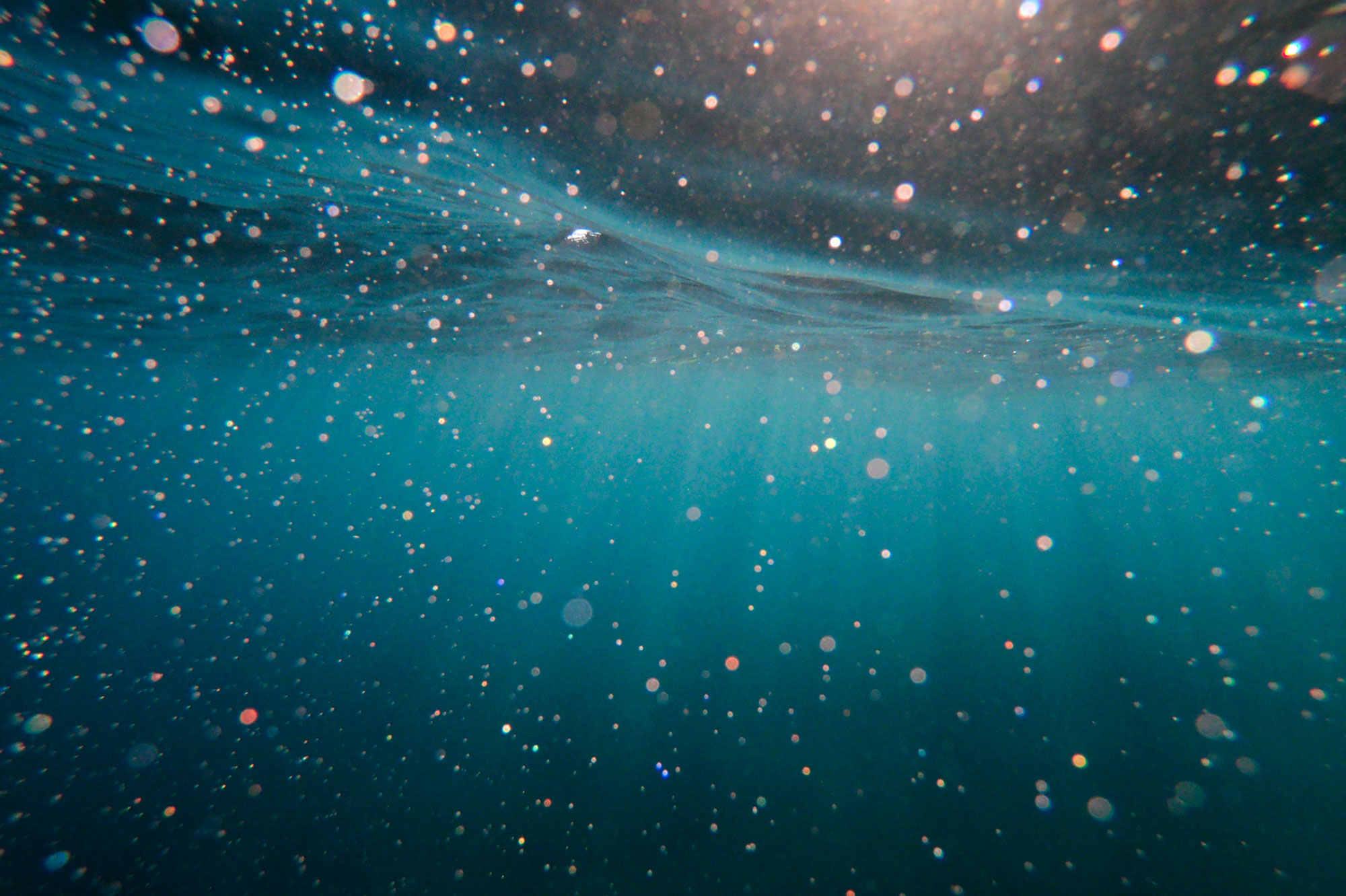 Under the ocean surface showing rays of light