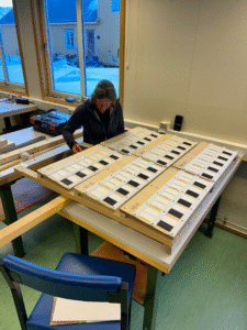 Rachel and Pennie building the deployment frame inside the UK Arctic Station.