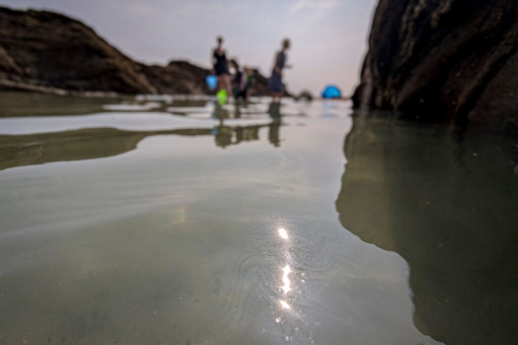 Sunscreen washed into a rockpool